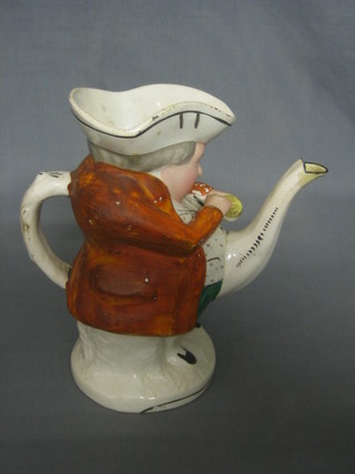 An 18th/19th Century Staffordshire pottery jug in the form of a standing Toby Philpot 10" (spout f and r)