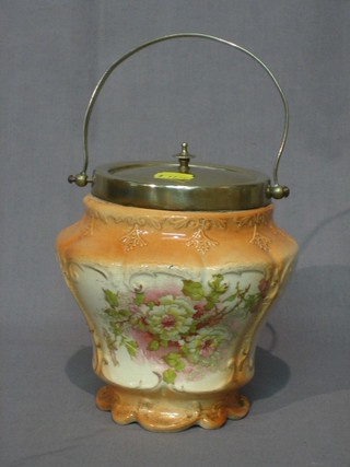 An Edwardian pottery biscuit barrel with silver plated mounts