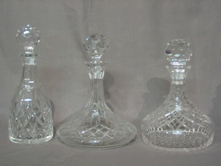 2 cut glass ships decanters and a club shaped decanter