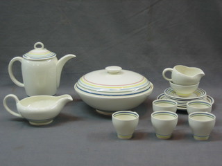 A 17 piece Susie Cooper Candy Stripe pattern dinner/tea service comprising circular vegetable tureen 8" (chip to rim), sauce boat, coffee pot (chip to lid), saucer 6 1/2", cream jug, 5 coffee cans, 6 coffee saucers (1 chipped), sugar bowl