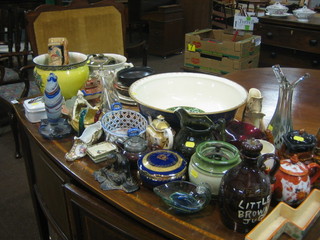 A Limoges blue glazed porcelain jar and cover, a green glazed tobacco jar, a large wash bowl, an oak biscuit barrel and decorative ceramics