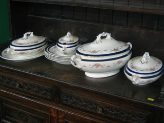 An 11 piece Wedgwood & Co Imperial porcelain dinner service manufactured for Maples comprising oval twin handled vegetable tureen and cover 16", a pair of oval vegetable tureens and covers 12", sauce tureen and cover 10", oval meat plate 14", 5 soup bowls 10 1/2", side plate 9 1/2"