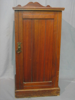 An Edwardian walnut pot cupboard enclosed by a panelled door 15"