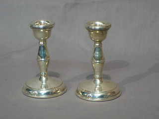A pair of silver stub shaped candlesticks Birmingham 1969, 4"