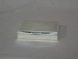 An Art Deco silver cigarette box with engine turned hinged lid, Birmingham 1938 4"