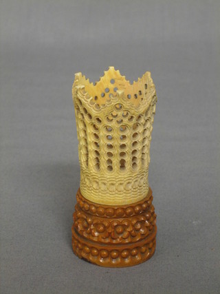 A carved ivory "libation" cup raised on a pierced stand 3 1/2"