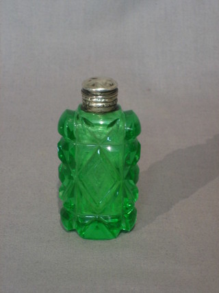 A Victorian green cut glass vinaigrette or scent bottle with silver mounts 3"