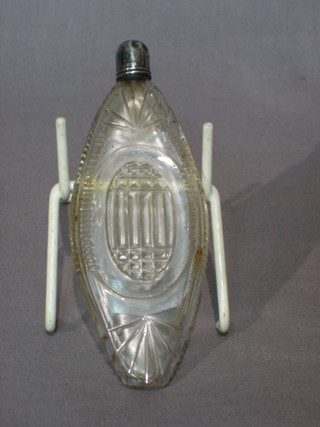 An oval cut glass scent bottle with silver collar 5"