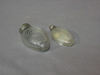 2 19th Century oval cut glass scent bottles with silver collars 2 1/2"
