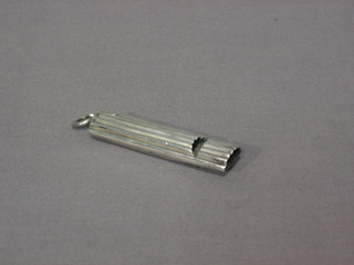 A Victorian reeded silver whistle, London 1889
