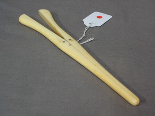 A pair of "ivory" glove stretchers