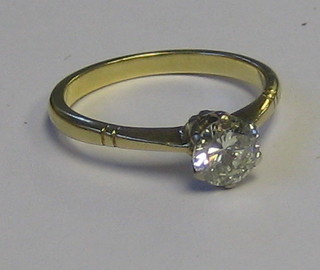 A lady's gold dress ring set a solitaire diamond (approx half carat)