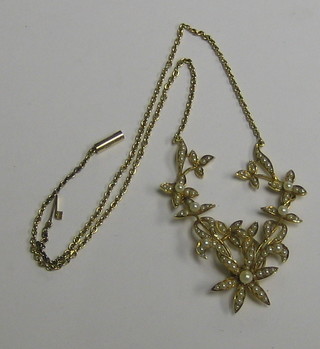 A lady's handsome 15ct gold floral necklet set numerous demi-pearls