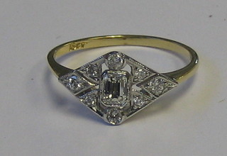 A lady's 18ct yellow gold Art Deco style dress ring set a rectangular cut diamond supported by numerous diamonds