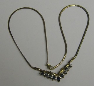 A lady's 9ct gold necklet set blue and white stones