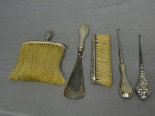 2 button hooks with silver handles, do. shoe horn, clothes brush and table brush