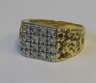 A gentleman's 18ct gold dress ring set 16 diamonds