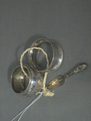 A silver book mark in the form of a trowel and 2 silver napkin rings