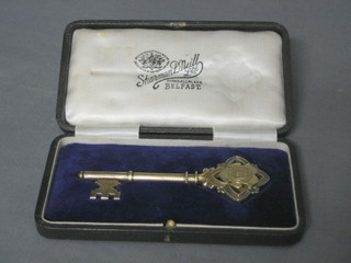 A silver gilt presentation key, Birmingham 1931 presented to Mrs A R C Gordon by the architect Castor J Love on the occasion of the opening of Derry Box New PE School 26 July 1934, cased