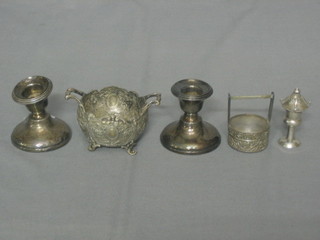 A pair of silver stub candlesticks 2" (1f), an Eastern Oriental white metal salt in the form of a bucket, a pepper in the form of a Chinese lantern and an embossed white metal twin handled salt