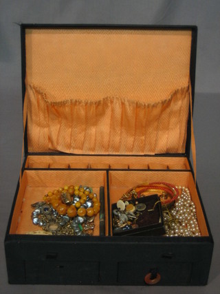 A 1920's Oriental embroidered jewellery box with hinged lid containing a collection of costume jewellery