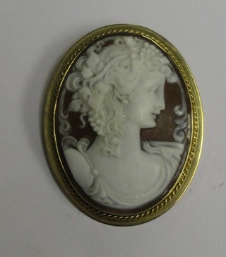 A shell carved cameo brooch contained in a 9ct gold mount