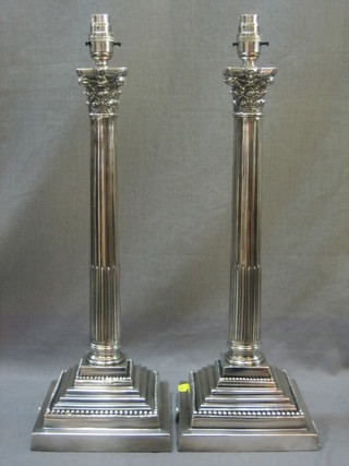 A pair of reeded silver plated table lamps with Corinthian column capitals 18"