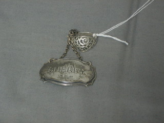 A silver decanter label marked Sherry and a silver dress ring