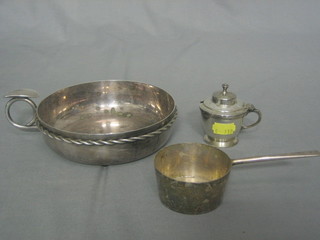 A circular silver ashtray in the form of a wine taster 6", a silver plated brandy saucepan by Harrods and a silver plated mustard pot