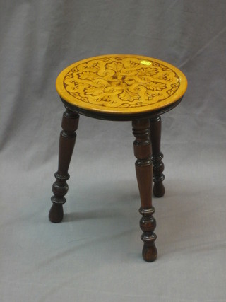 A 3 legged stool with Poker work decoration 11"