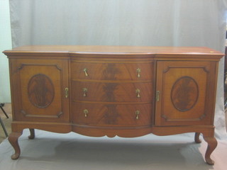 An Edwardian walnut bow front sideboard fitted 3 drawers flanked by double cupboards, raised on cabriole supports 71"