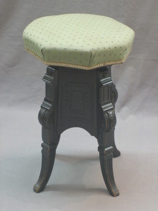 A 19th Century ebonised adjustable revolving piano stool