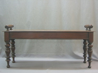A 19th Century mahogany hall bench raised on turned supports 38"