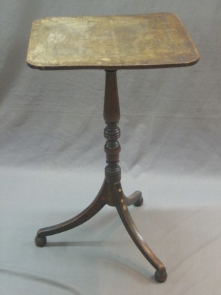 A 19th Century rectangular mahogany snap top breakfast table, raised on a pillar and tripod base (f and r) 60 1/2"