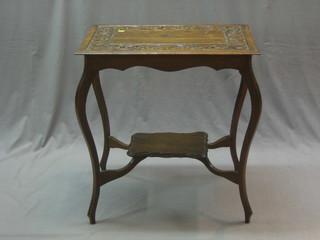 A Victorian rectangular carved oak 2 tier occasional table, raised on cabriole supports, the top carved throughout 26"