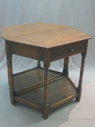 A pair of 1930's oak Credence side tables fitted a drawer raised on turned and block supports with undertier 34"