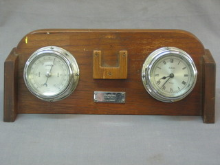 A ships style aneroid barometer and 8 day clock contained in chrome case and raised on a mahogany plinth marked Bambino Salcombe