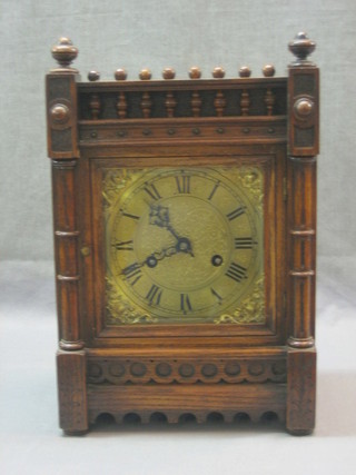 A 19th Century Continental 8 day striking mantel clock with square silvered dial and Roman numerals, contained in an oak case