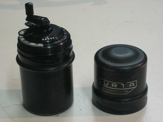 A Curta Type I calculator complete with photocopy instructions