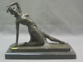 A 20th Century reproduction bronze figure of a reclining Russian dancer, raised on a marble base 13"