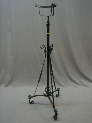 A Victorian adjustable iron oil light stand