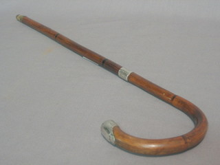 An Edwardian bamboo walking cane with silver mounts Birmingham 1907, reduced in length, 15"
