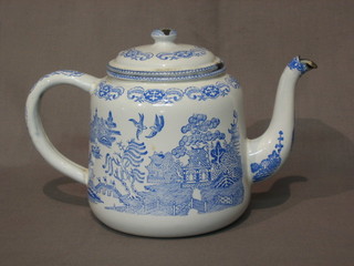 A blue and white Willow pattern enamelled teapot 