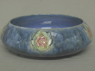 A circular Royal Doulton salt glazed bowl with blue glazed decoration, the base impressed Royal Doulton England 8710 11"