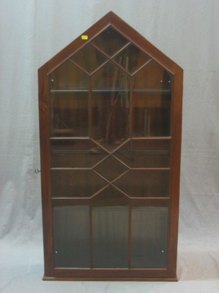 A 19th Century mahogany triangular shaped hanging wall cabinet enclosed by astragal glazed panelled door, 24"