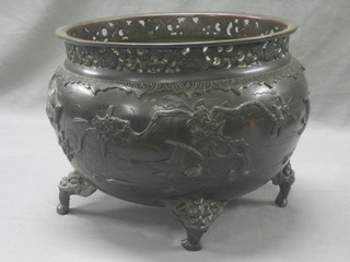 A 19th Century Oriental bronze jardiniere with pierced rim, the body cast birds amidst branches, the base with seal mark 12"