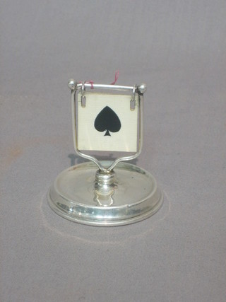 A silver trumps indicator raised on a circular base, London 1922