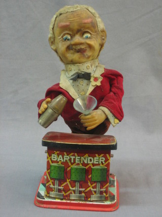 A battery operated toy in the form of a cocktail barman