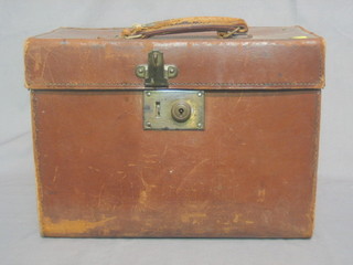 A leather case with hinged lid and brass fittings 15"