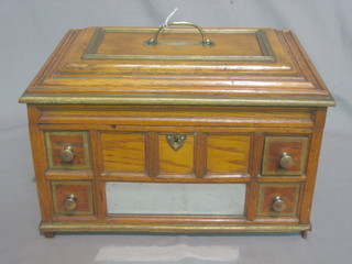 A Victorian oak work box with hinged lid, the interior fitted 3 tapestry hoops, the base fitted 4 short drawers 13"